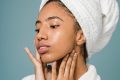 pexels-photo-5938539-5938539 Young woman in a spa setting applying skincare with a fresh clean look.